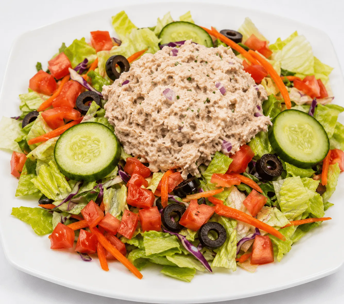Tuna Salad with light tuna, celery and red onions on a bed of mixed greens