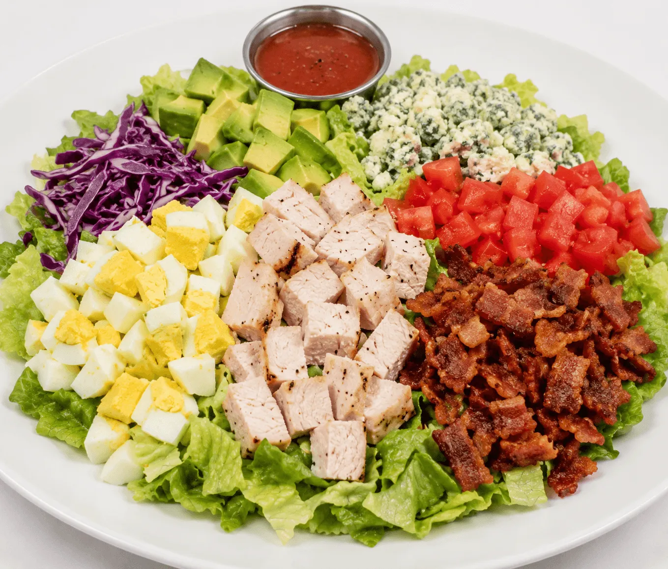 Turkey Cobb Salad with turkey, iceberg lettuce, bacon, avocado and blue cheese crumbles